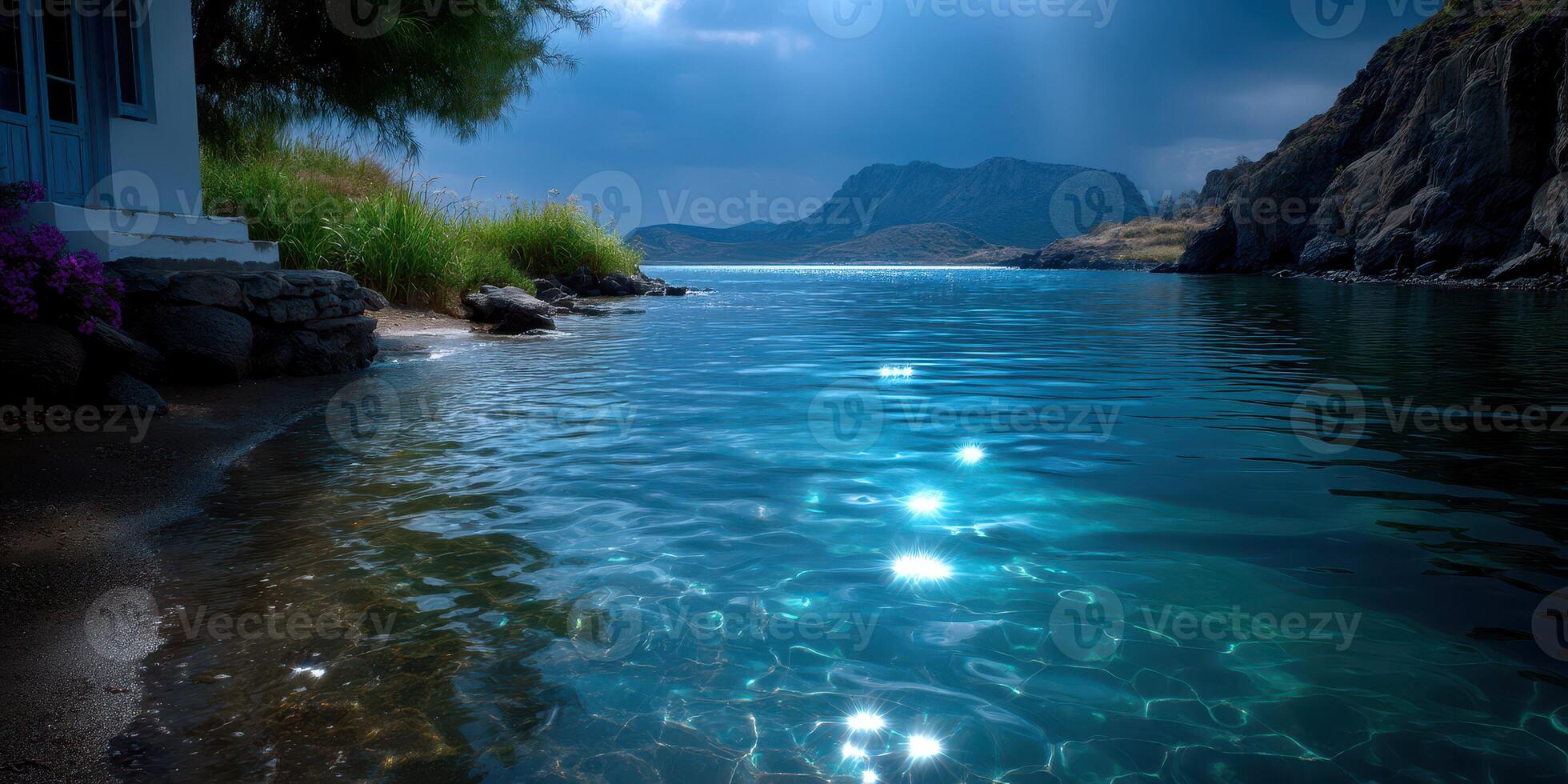 Serene coastal view with shimmering water reflecting sunlight in a tranquil bay surrounded by mountains photo