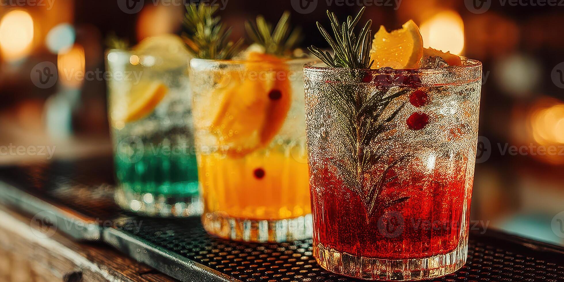 Colorful cocktails with citrus garnishes served at a vibrant bar during an evening gathering photo