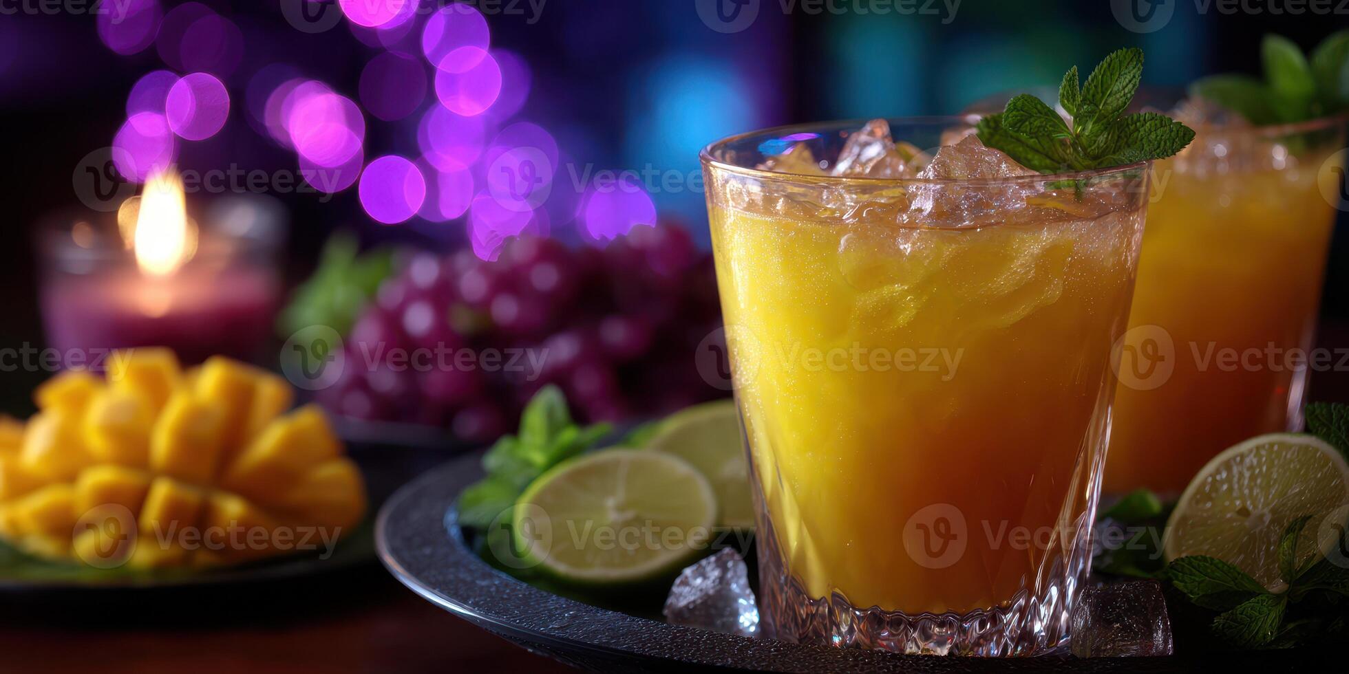 Refreshing tropical cocktails served with fresh fruit on a festive table with vibrant lights photo