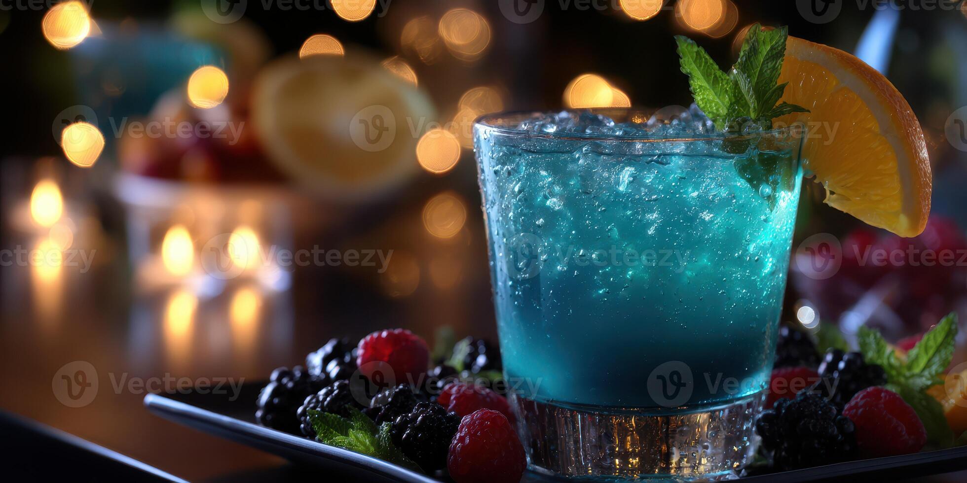 Refreshing blue cocktail garnished with mint and orange, served in an upscale bar setting at night photo