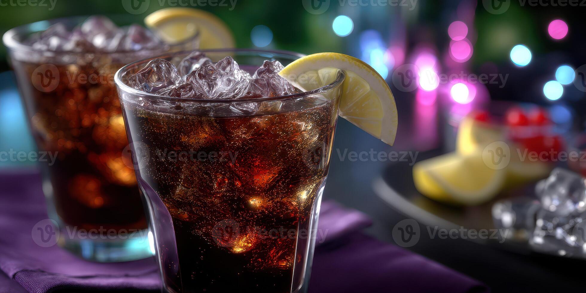 Refreshing drinks served in glasses with ice and lemon slices at a vibrant evening gathering photo
