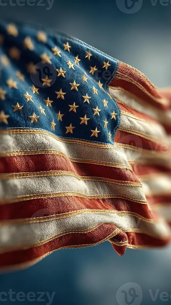 Waving American flag displays vibrant colors under a clear blue sky during a sunny day photo