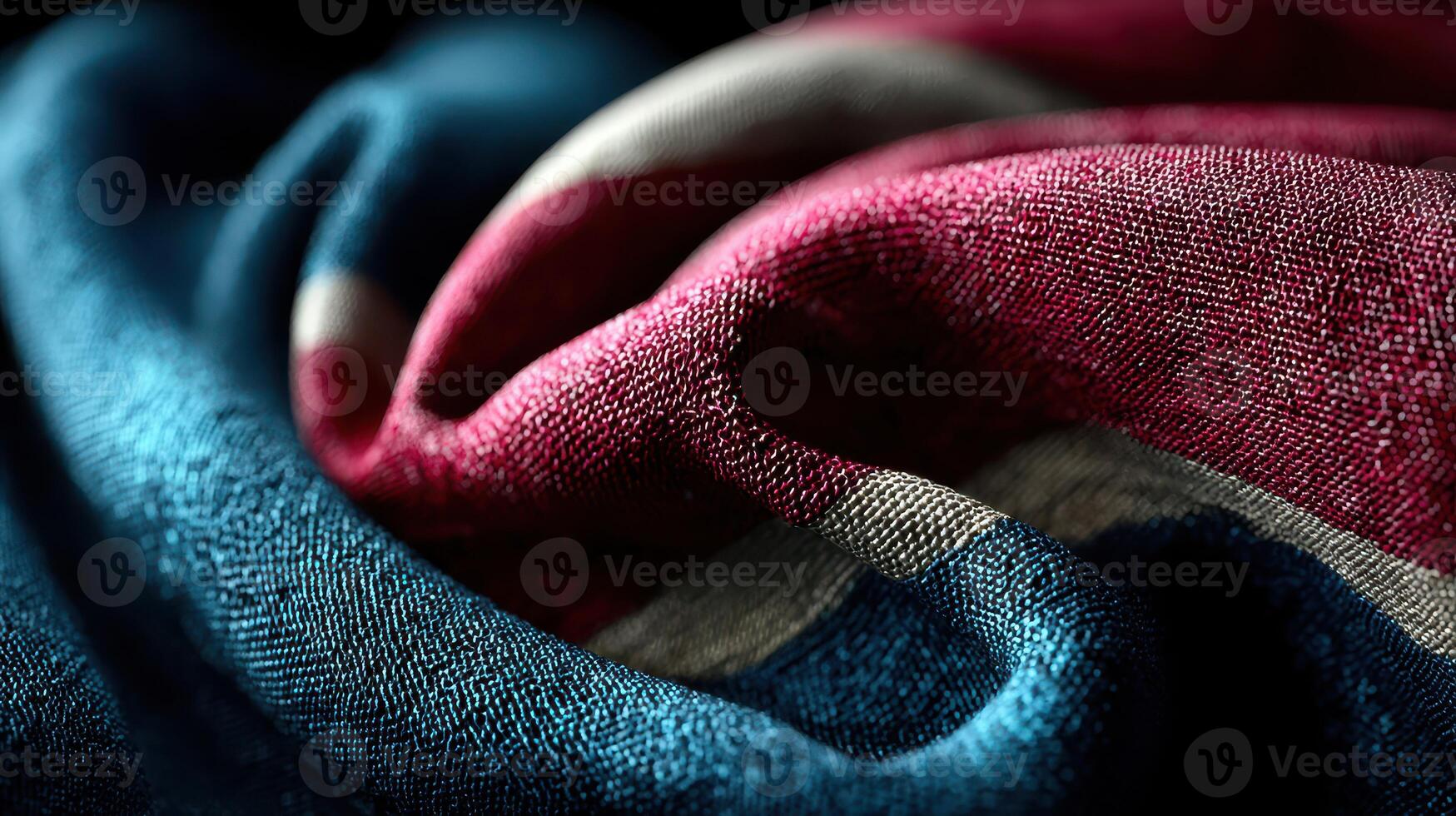 Detail of textured fabric with red, blue, and white colors displayed in a close-up view showcasing the weave and contrast of the materials photo
