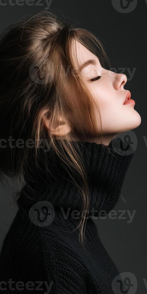 Captivating side profile of a woman in a black turtleneck sweater photo