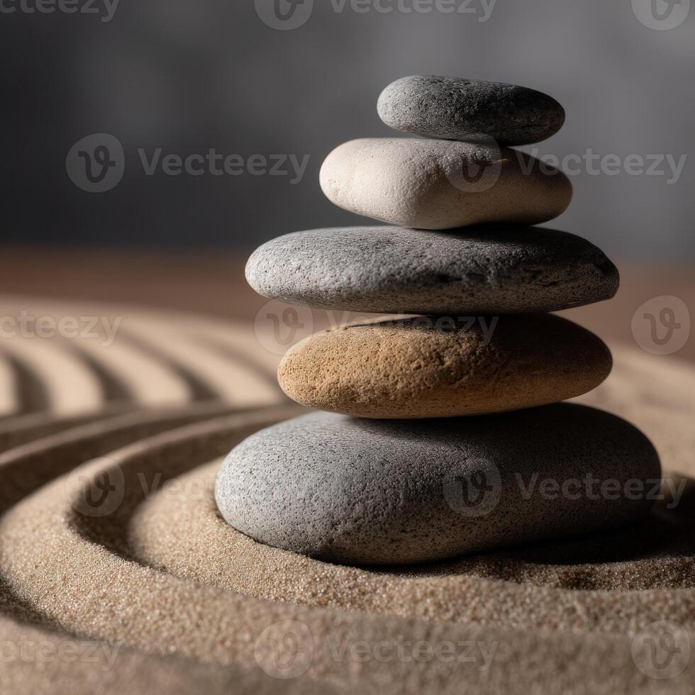 Balancing stones in a serene sand circle creating a calming atmosphere photo