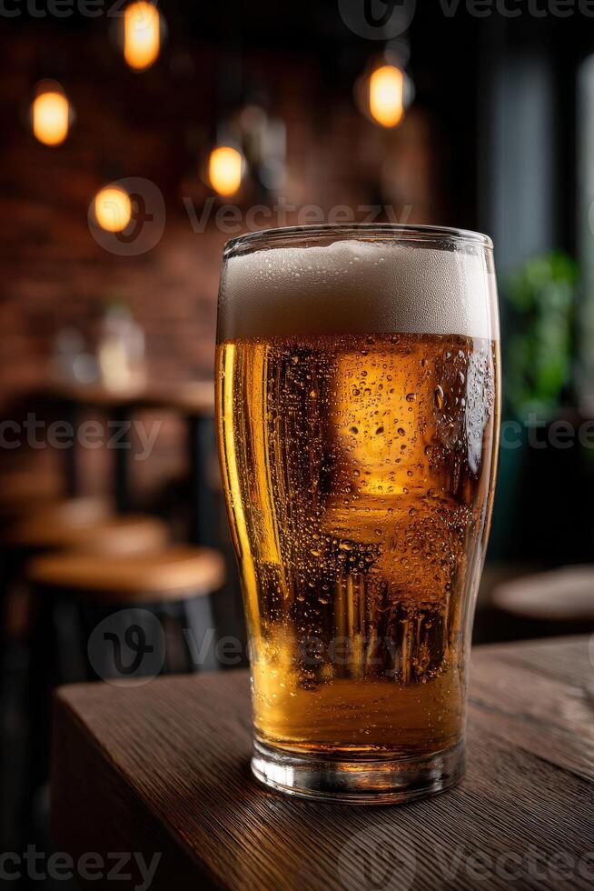 Craft beer served in a chilled glass at a cozy pub in the evening photo