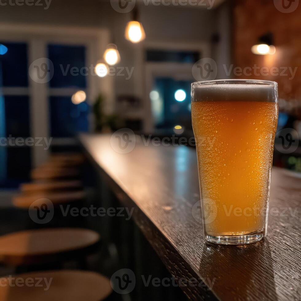 Refreshing beer served at a cozy bar during the evening hours photo