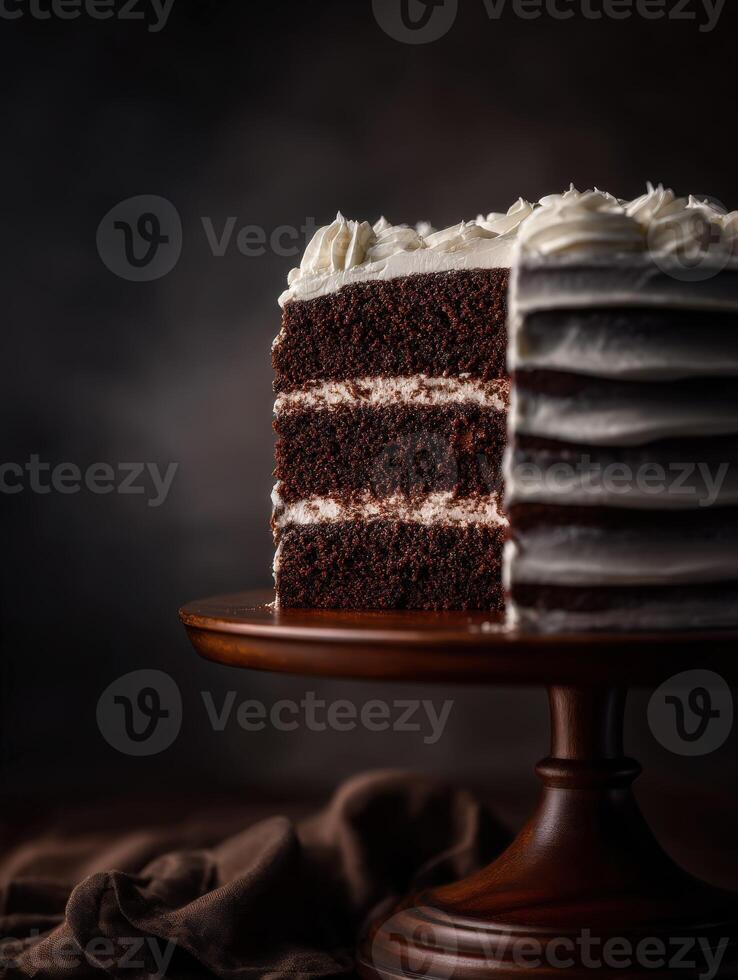 A piece of chocolate cake on a wooden stand photo
