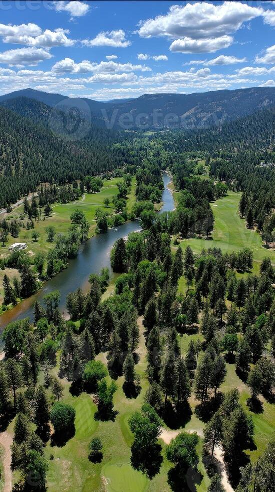 Stunning aerial view of a lush green valley with winding river and mountains photo