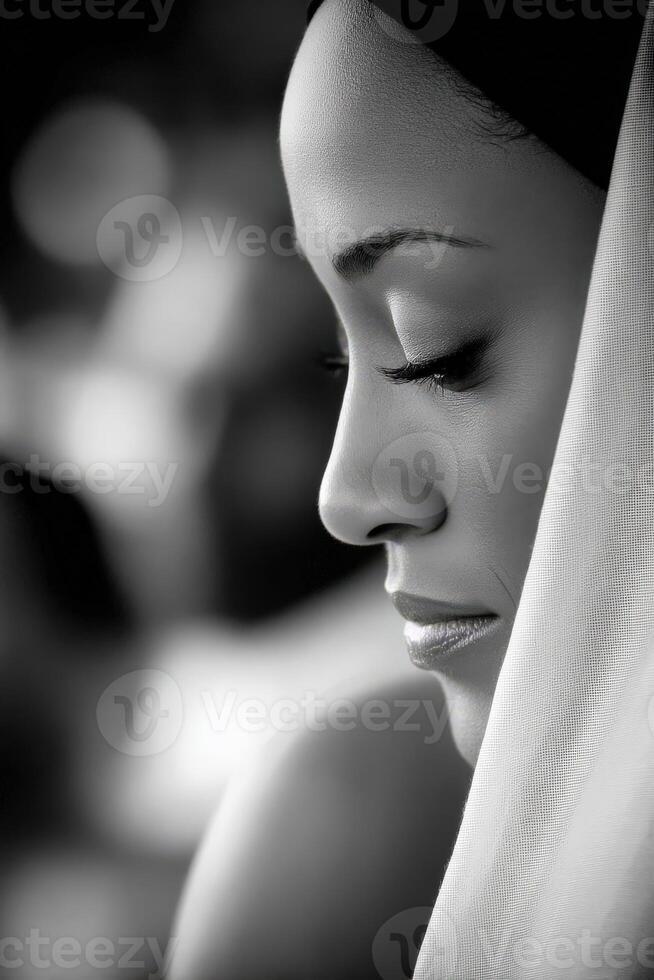 Profile of woman with closed eyes wearing headscarf near window photo