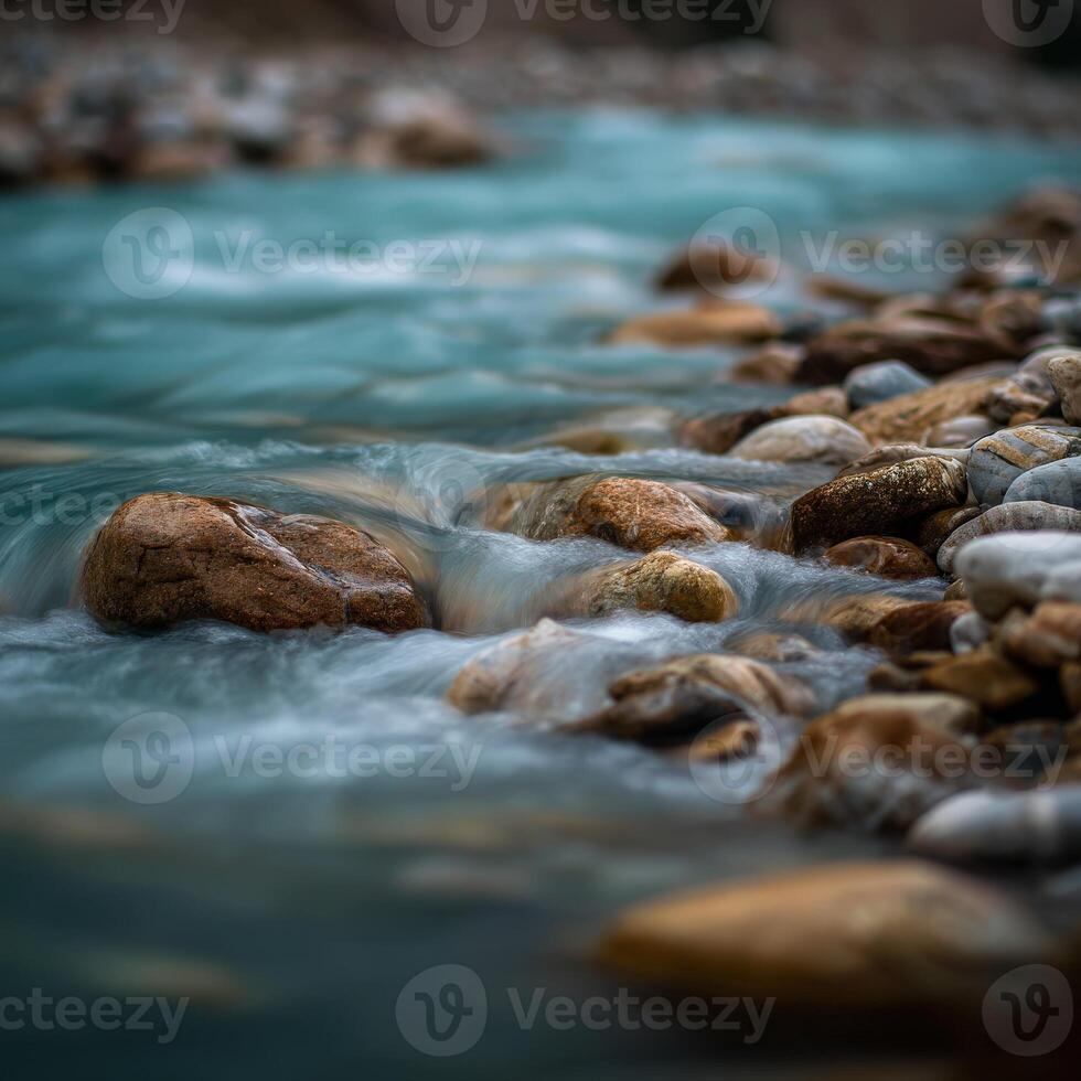 River flows around smooth rocks in nature during a daytime walk photo