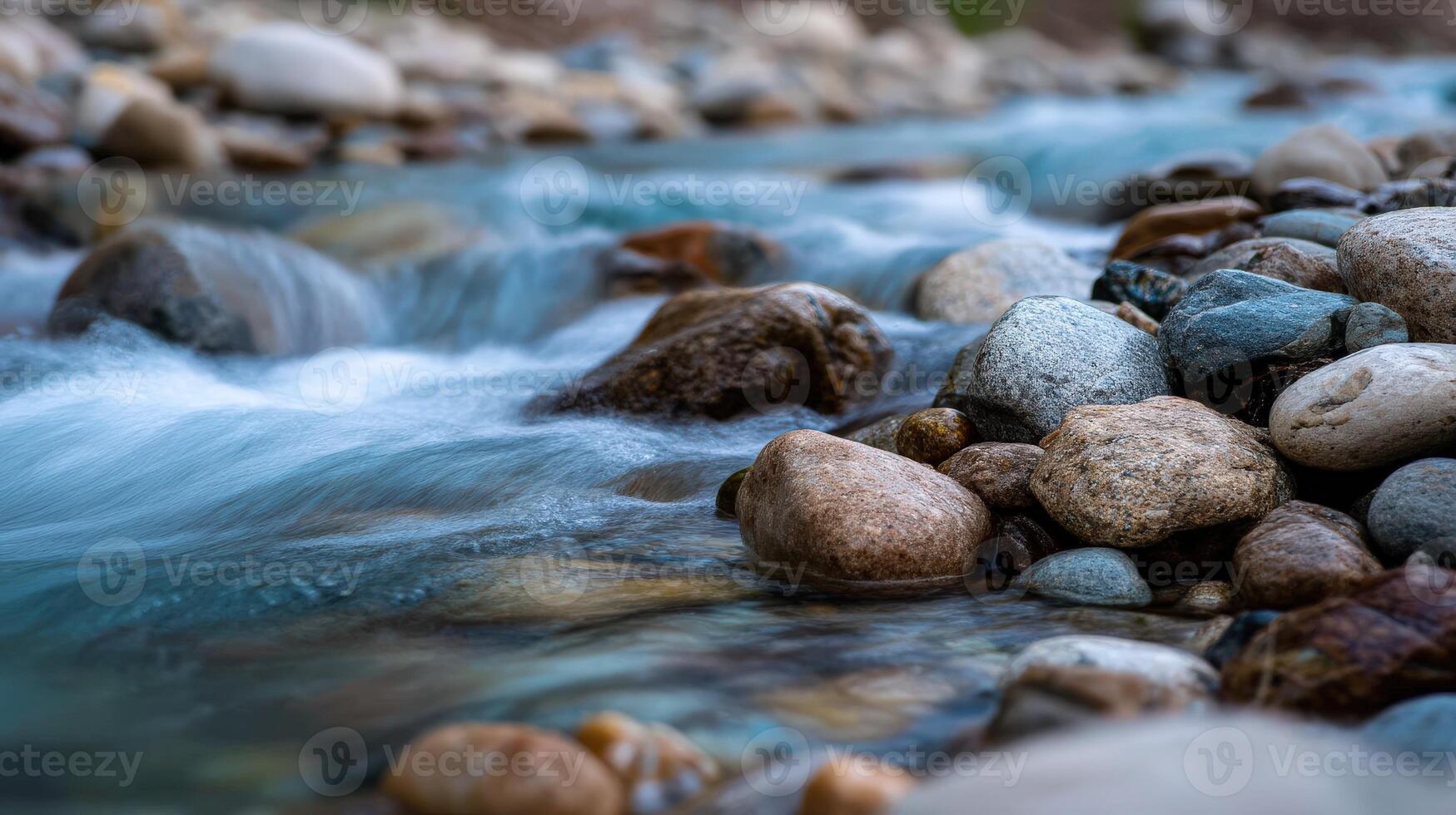 River waters flowing through stones on riverbed at daytime photo