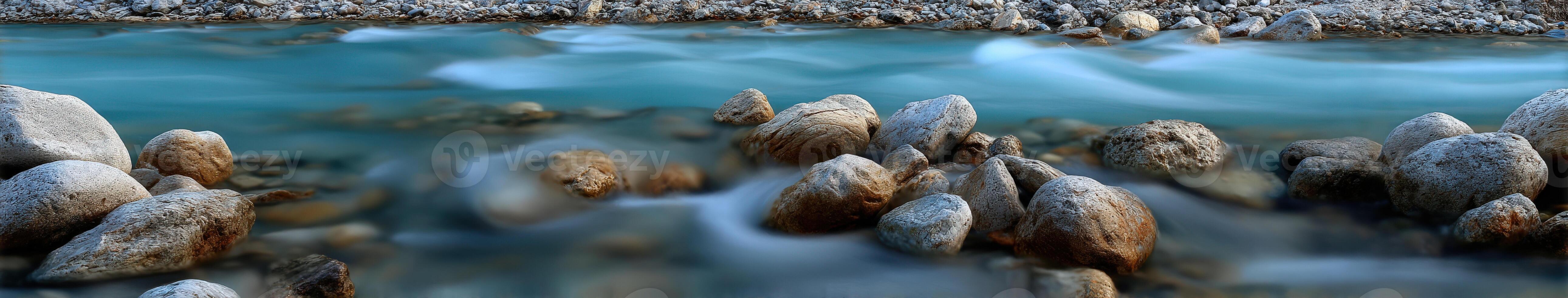 Mountain stream flowing over Rocks in the early morning photo