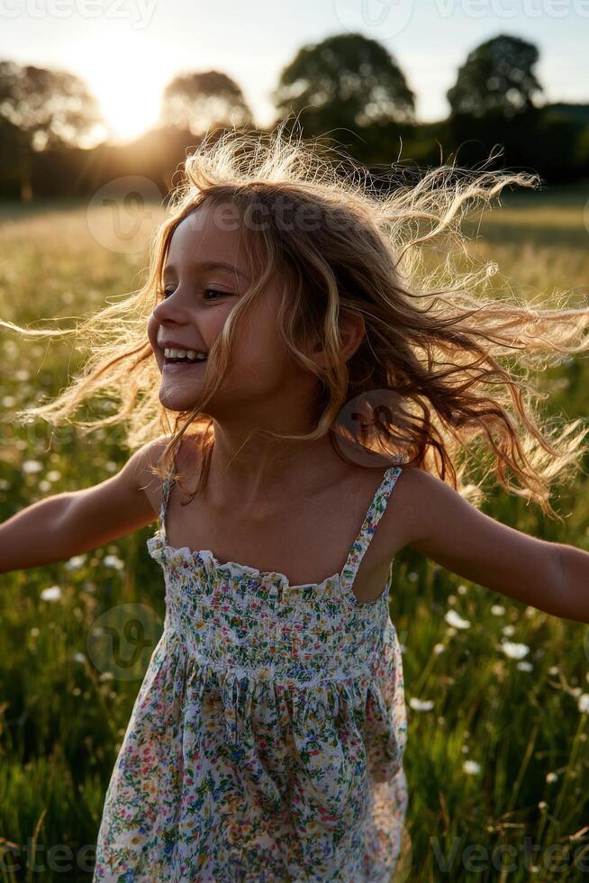 Little girl runs happily through a grassy field in Summertime photo