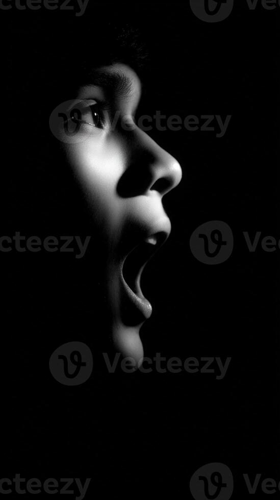 Person screaming in the dark black and white portrait photo