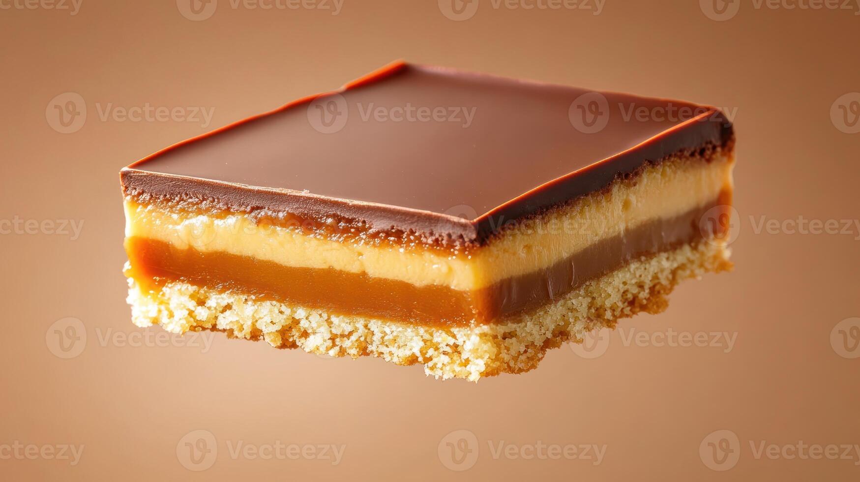Caramel chocolate slice dessert, sweet treat on brown, studio shot for recipe site or menu usage photo