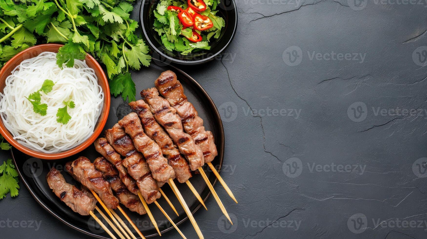 Delicious meat skewers on a plate with noodles and herbs, overhead view. Food photography photo