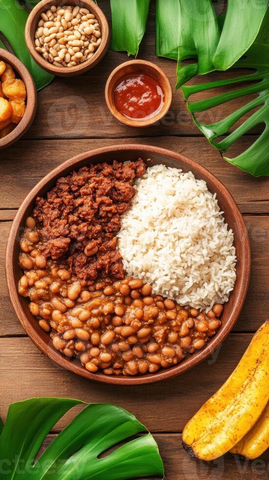 Delicious rice, meat and beans served on a wooden plate, against a leafy backdrop, for food blog photo