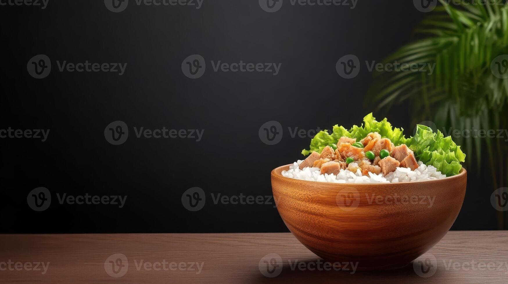 Food bowl with rice, meat and salad on a table, plant on the background, use in recipe ideas photo