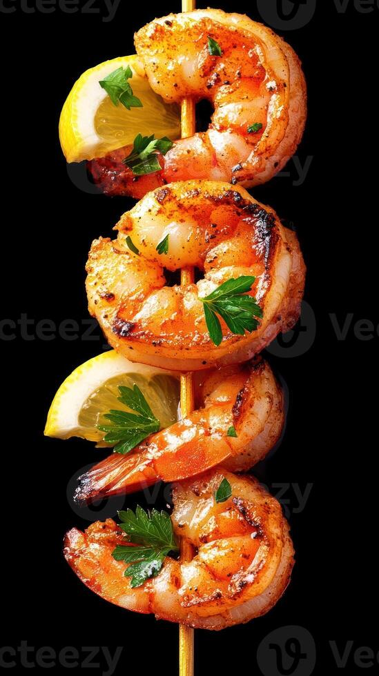Grilled Shrimp Skewers with Lemon. Black background. Used for menu or cooking blogs photo
