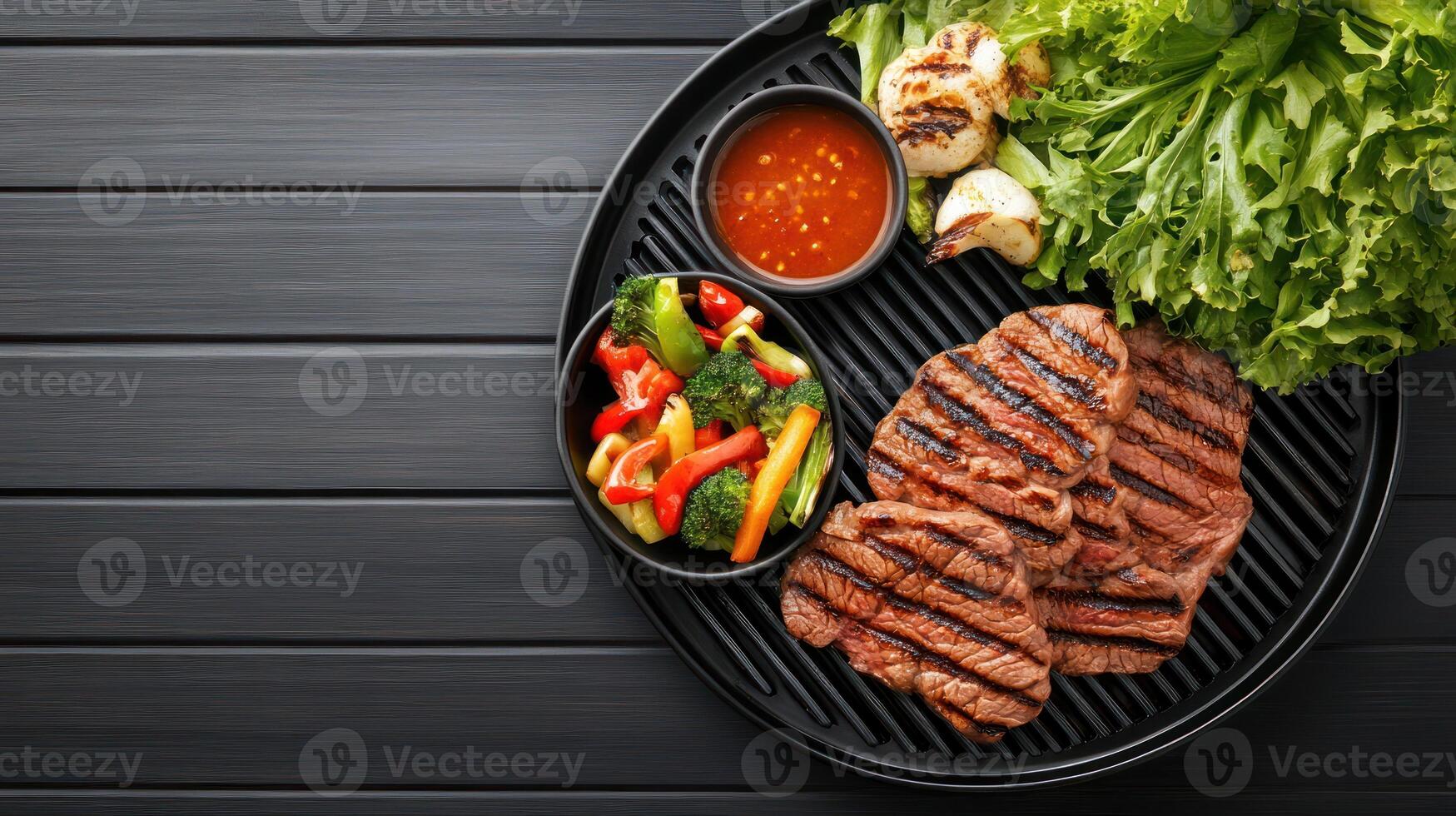 Grilled steak, salad, and veggies on a grill. BBQ background for food website, menus, promotions photo