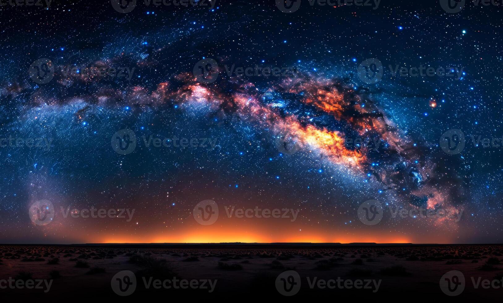 Milky Way over desert. The Milky Way galaxy shines brightly over a vast desert landscape during a clear night, revealing countless stars. photo