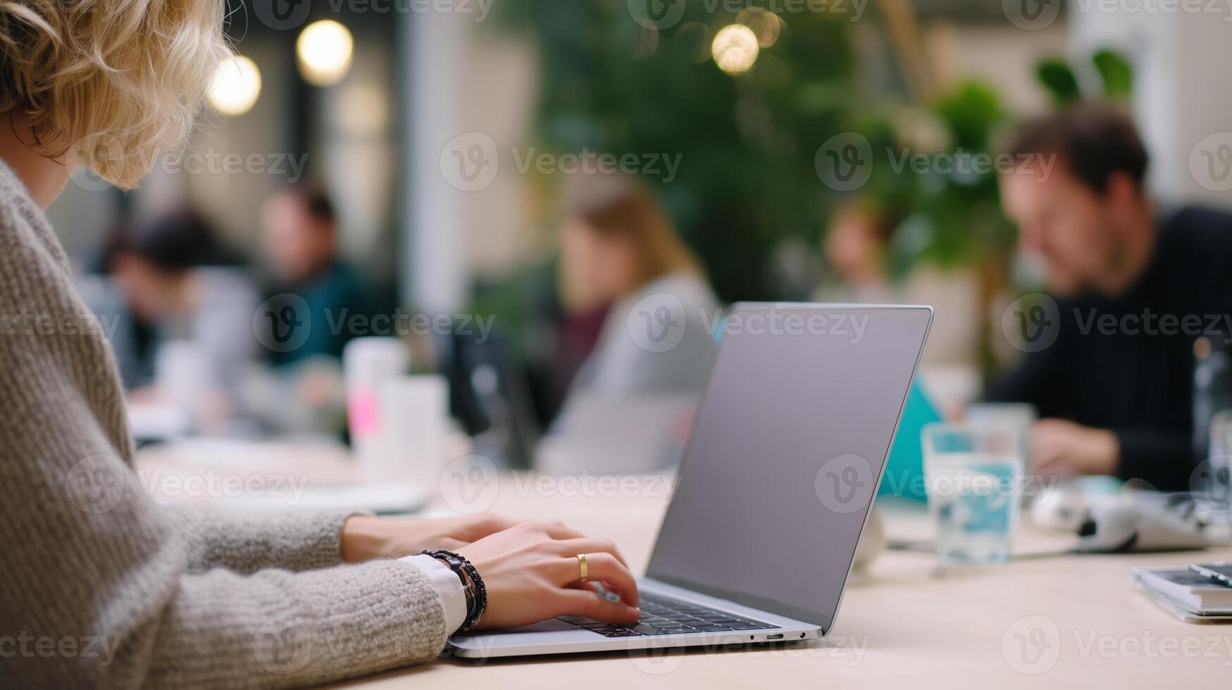 Busy coworking space with people engaged in work and collaboration photo