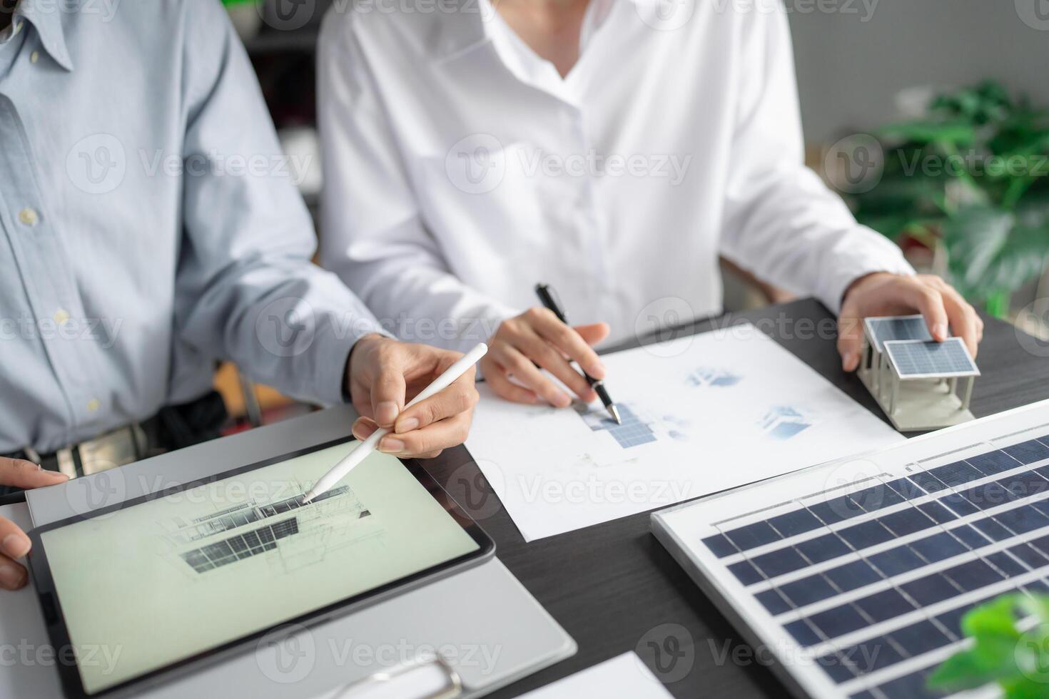 Solar panels Businessman working green eco friendly office business creative idea Planing Bio economy for business eco friendly professional Engineer sustainable electricity. photo