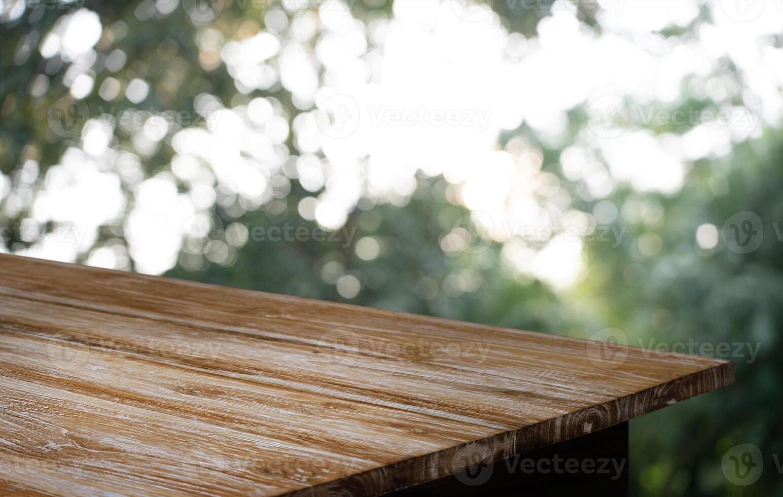 a wooden table with a blurry background photo