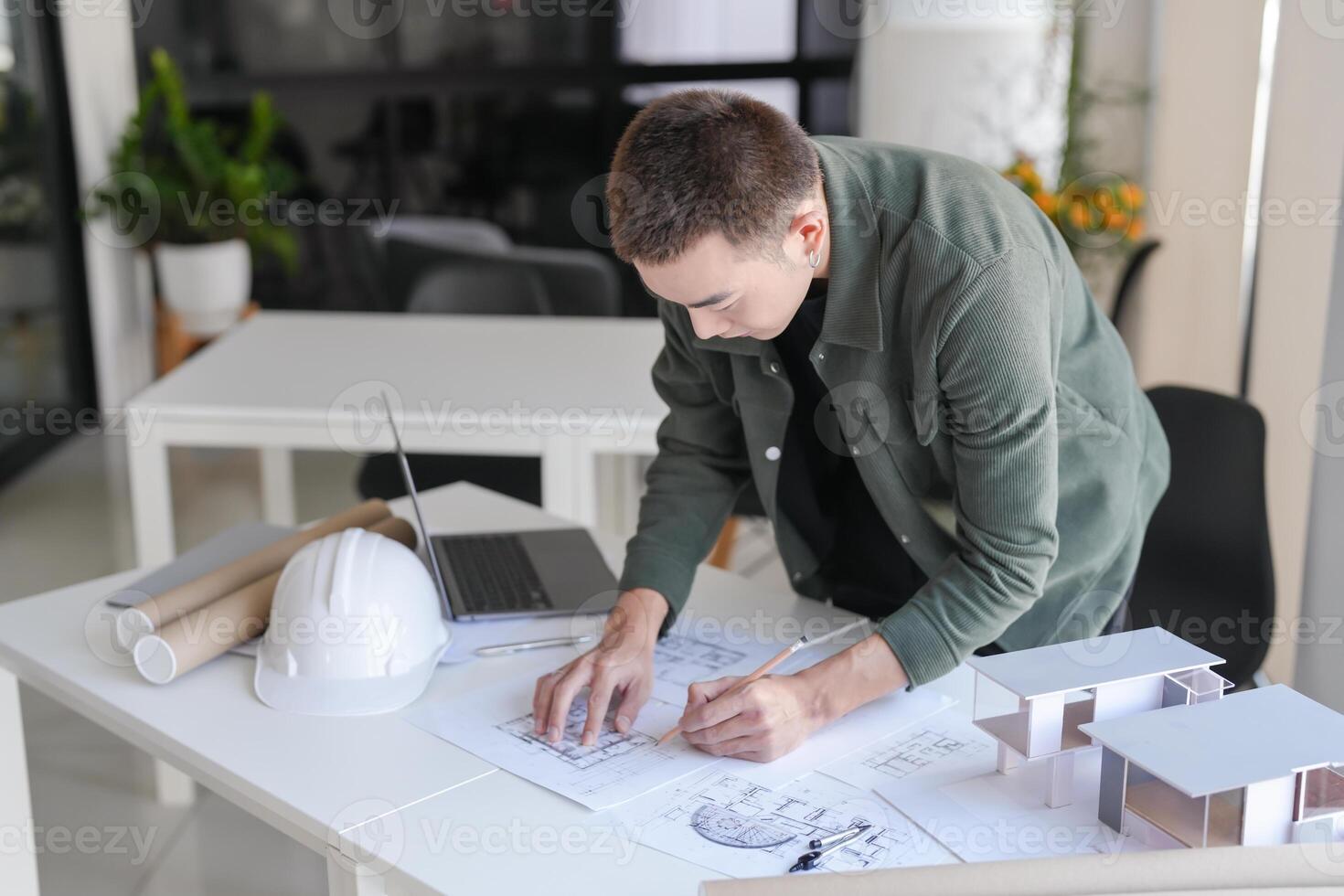 a man is working on a project with a hard hat photo