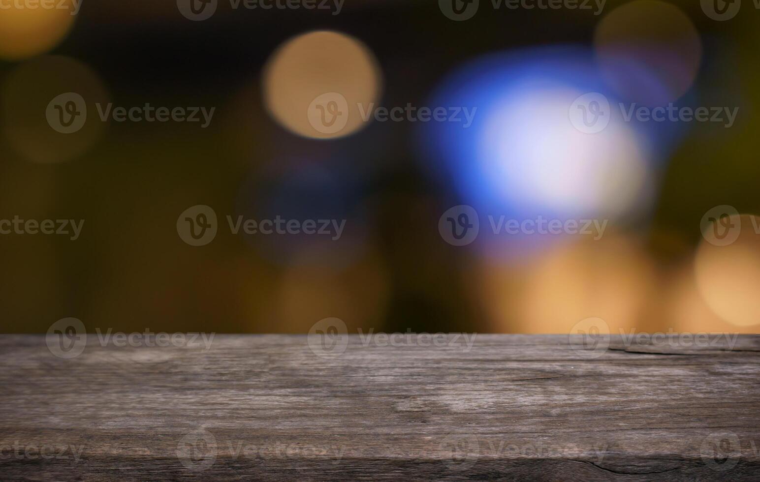 the wooden table top with blurred bokeh lights photo