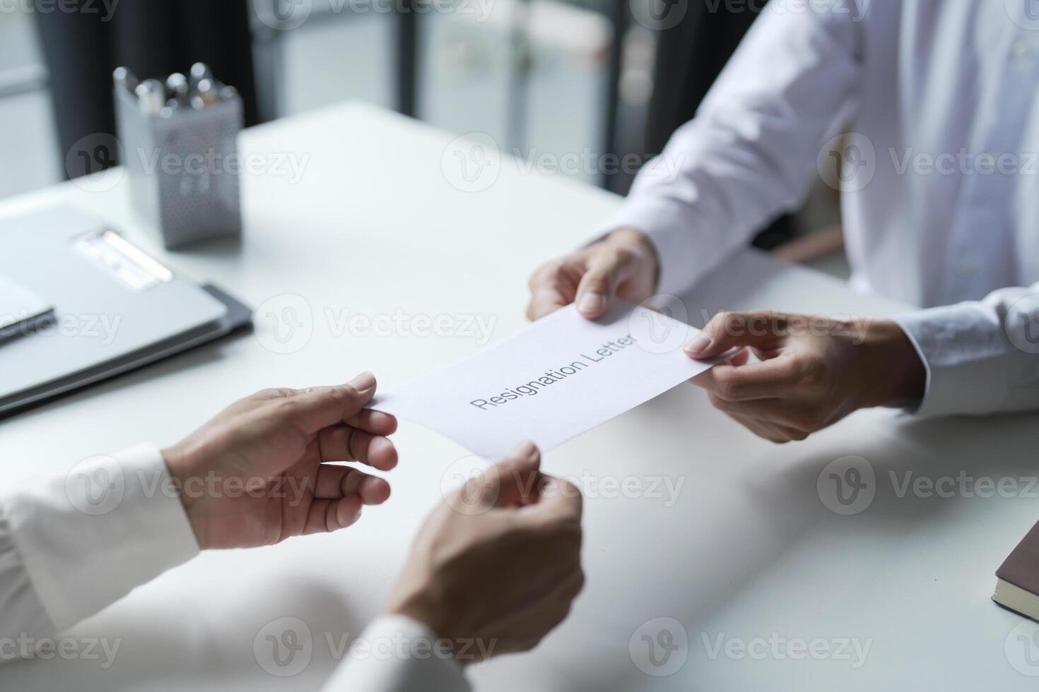 Business man sending resignation letter to boss photo