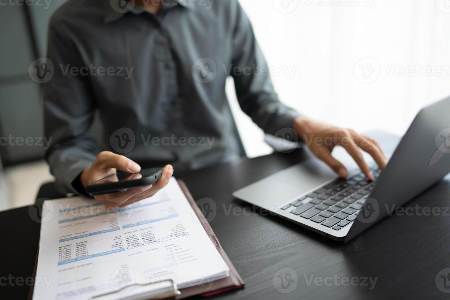 Asian Businessman with Smartphone working mobile devices cell telephone technology e-commerce smartphone business professional investor working new start up project photo