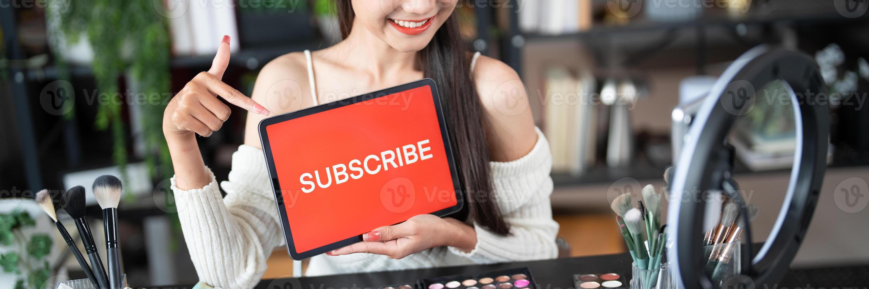 Online marketing Beauty influencer Using Social Media for live streaming on Smartphone online audience like and subscribe to her channel. Like Follower. photo