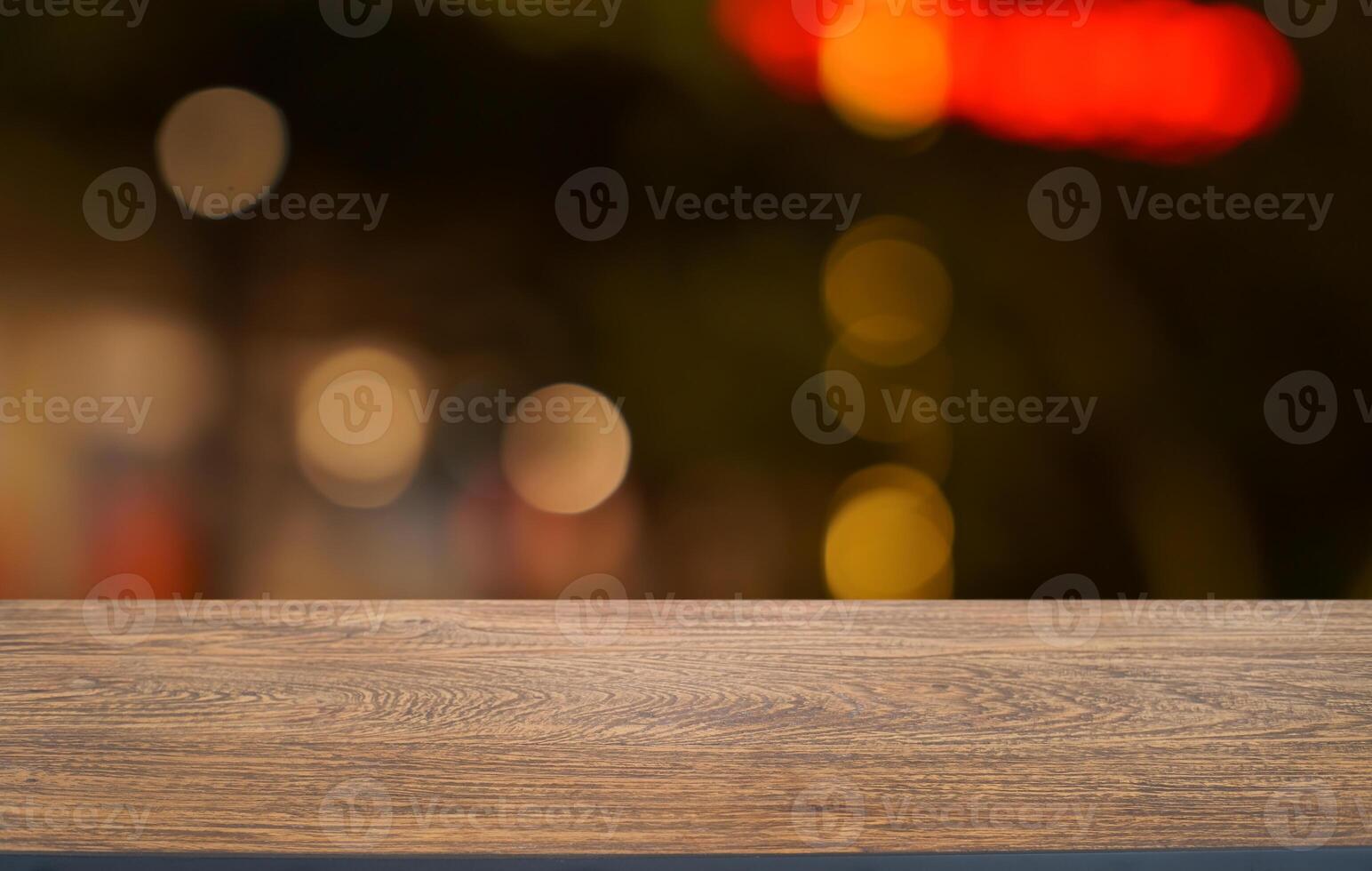 empty wooden table top with blurred background photo