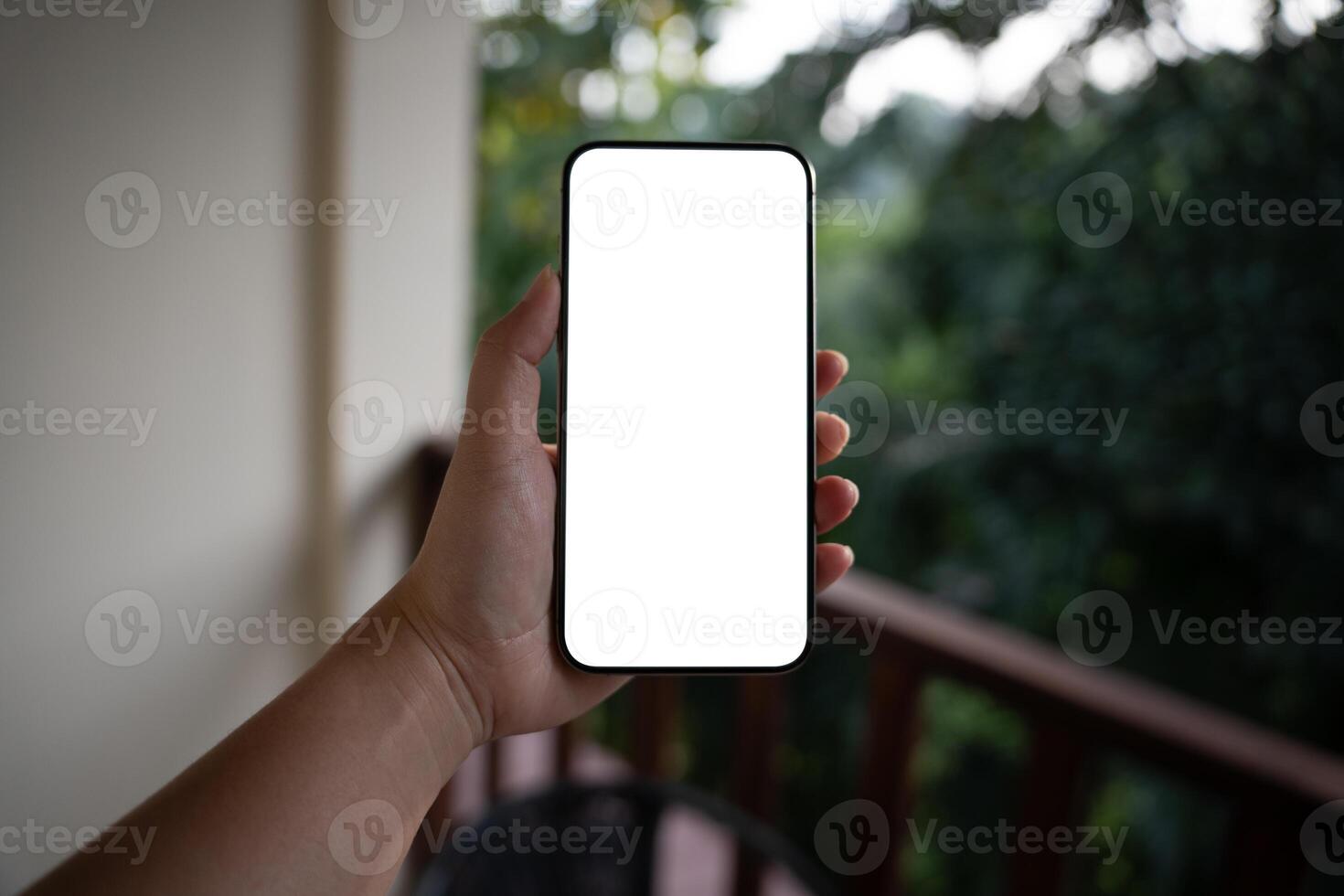 Smart phone mockup Women hands holding cell telephone blank copy space screen smartphone blank white screen isolated technology concept. photo
