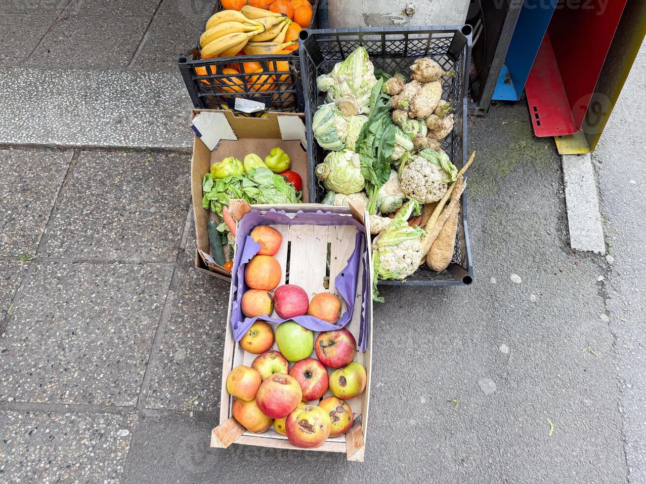 Pile of rotting kitchen fruits and vegetable scraps. Garbage waste for recycling as an environmentally responsible compost that enriches soil in a garden. photo