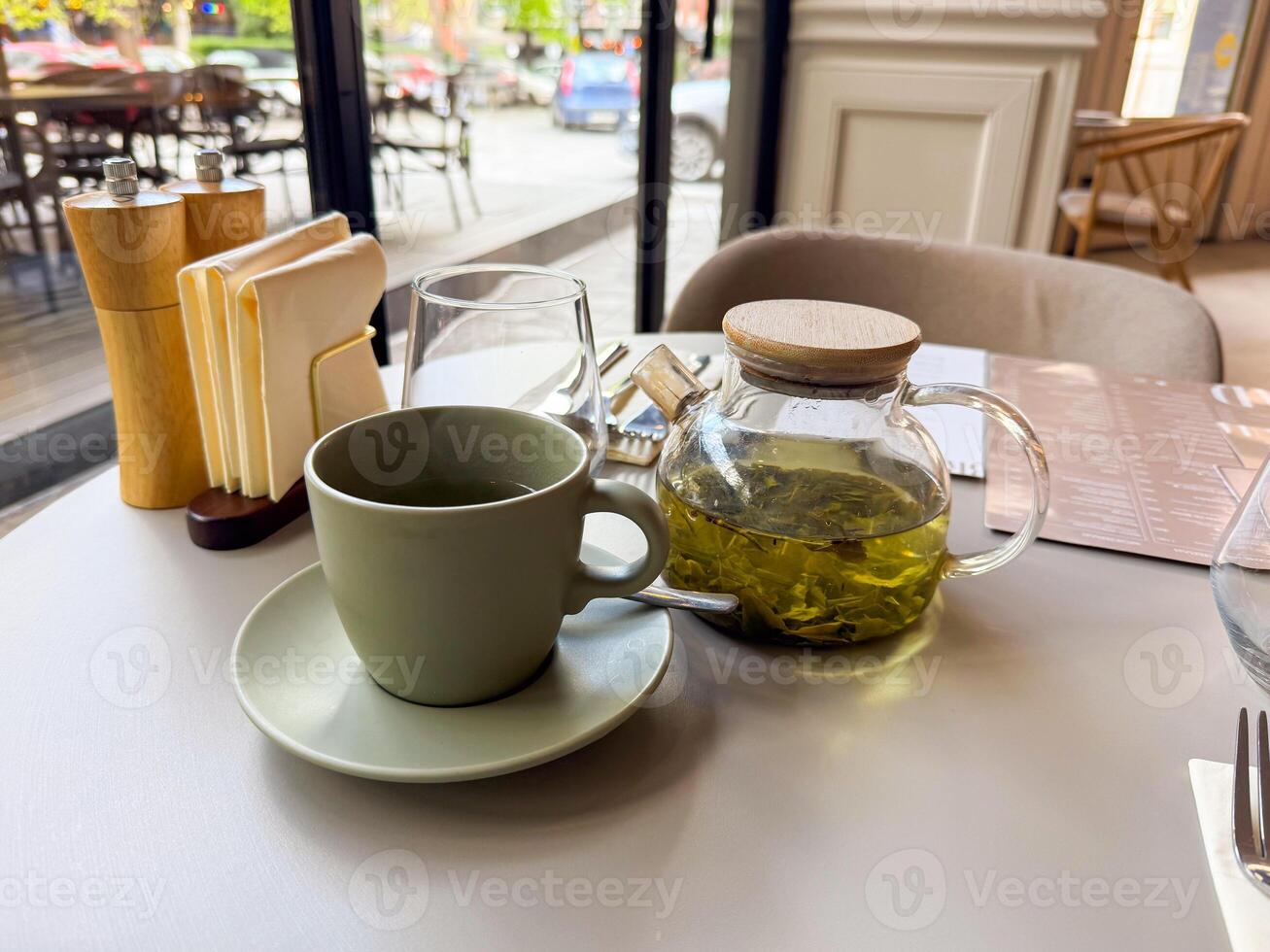 Minimalist cafe tea setting with a focus on herbal tea. Slow living photo