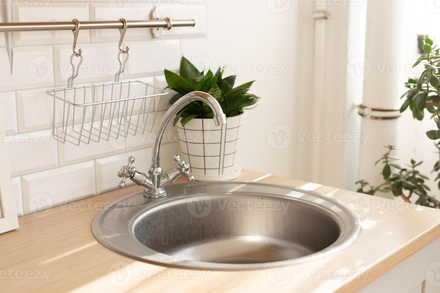 Kitchen silver sink modern decoration house stainless steel closeup at home photo