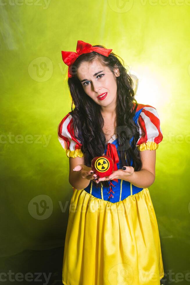 Danger, nuclear and radiation measurement - Sad Girl holds apple with radiation hazard symbol. photo