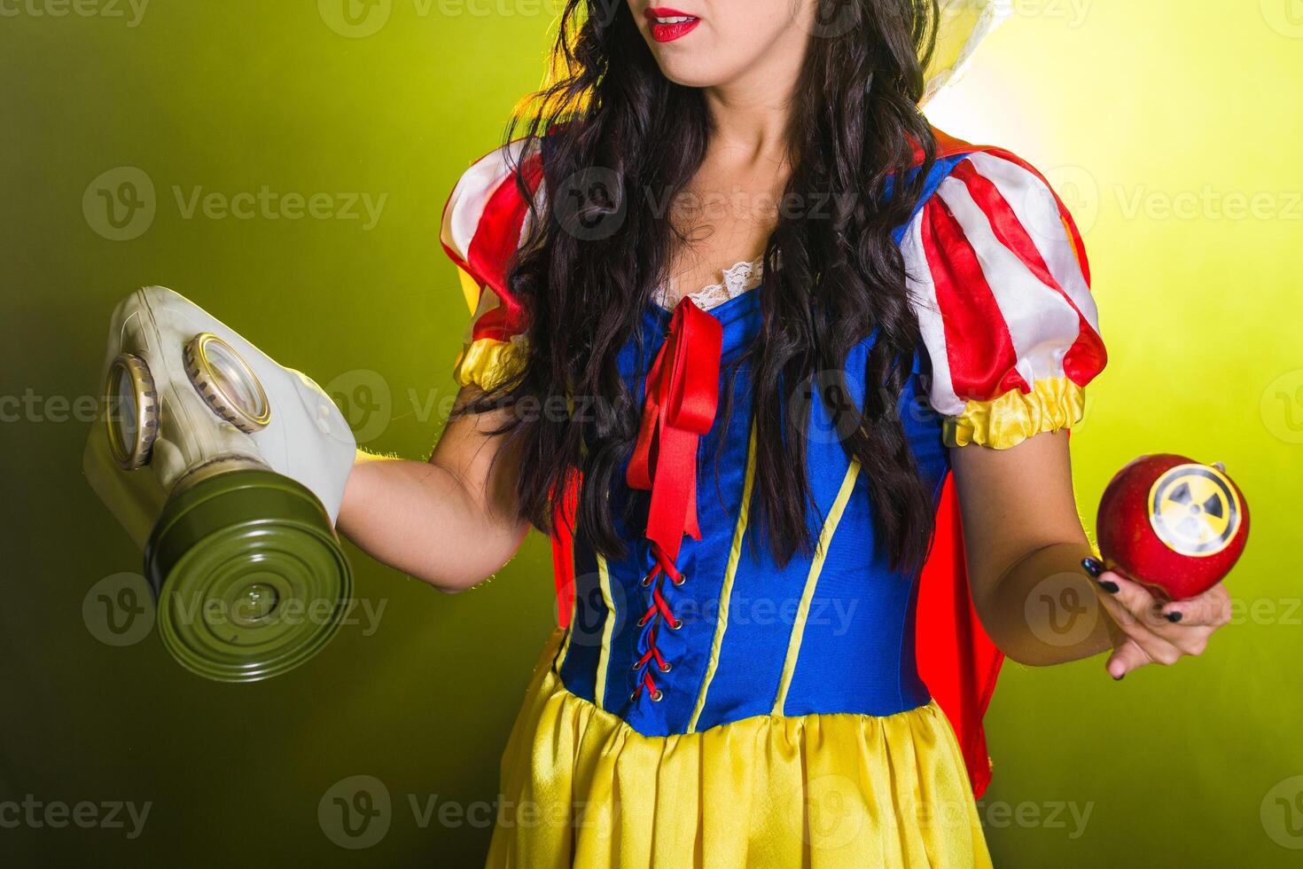Danger, nuclear and radiation measurement - Close-up Girl holds apple with radiation hazard symbol. photo