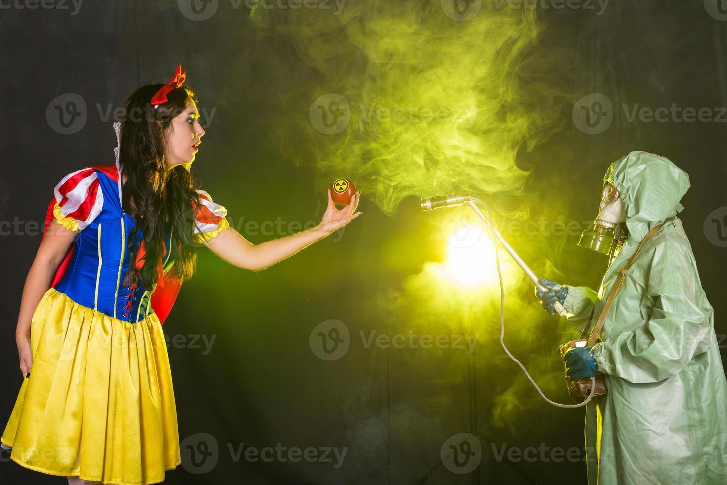 Woman holding hazardous radioactive apple. Nuclear and radiation concept photo