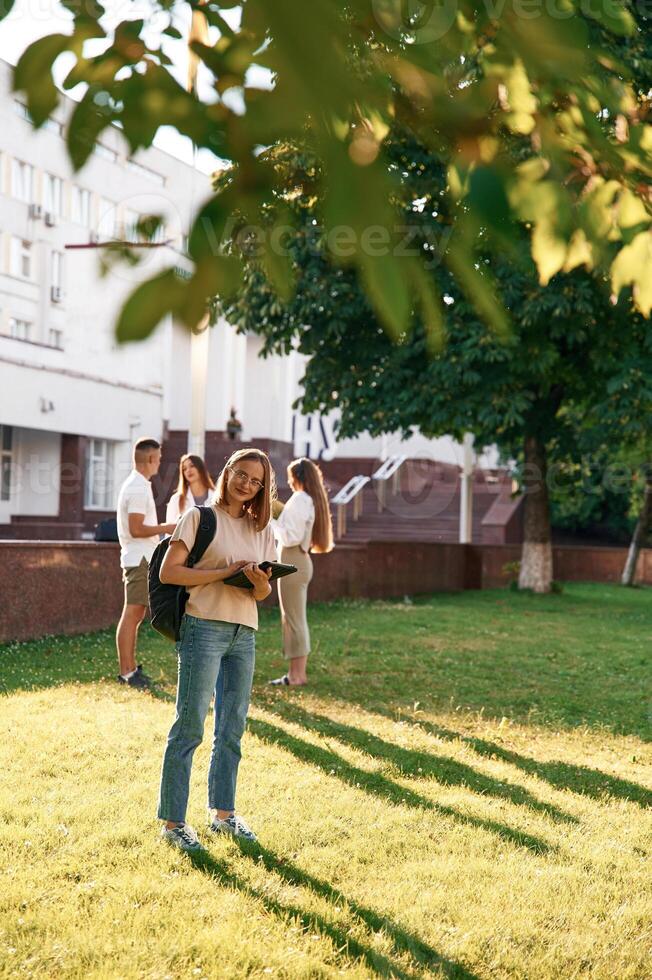 Bonding,, positive emotions. Group, of, students are outside together photo