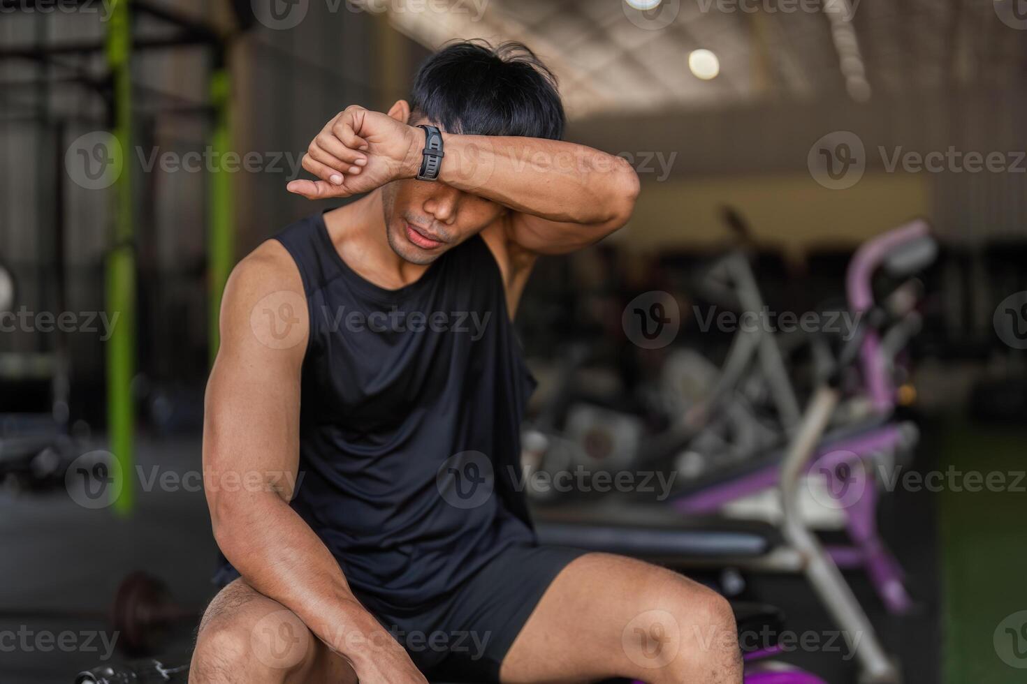 Post-Workout Reflection. Young Man in Gym After Kettlebell Session photo