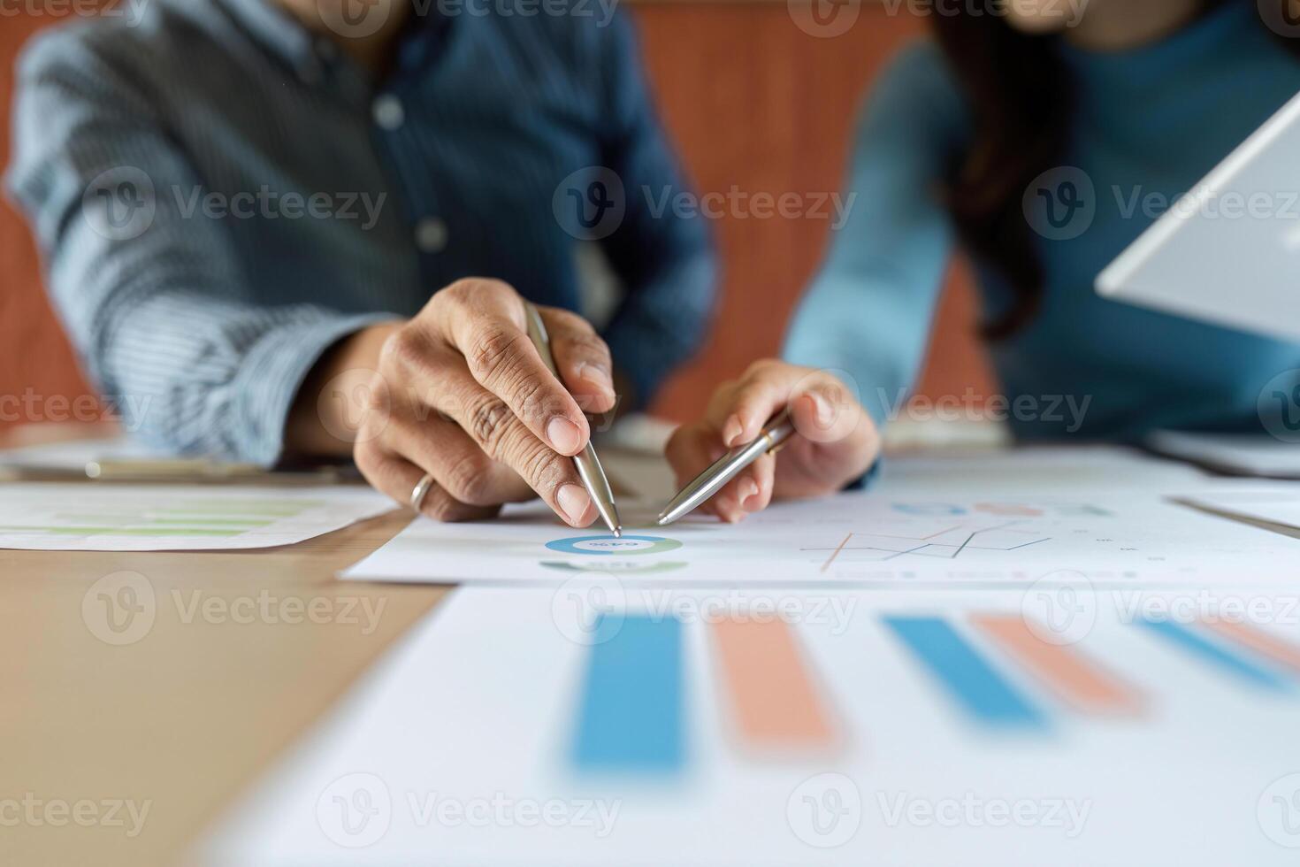 ESG Business Discussion. Professionals analyzing data and charts for sustainable development. photo