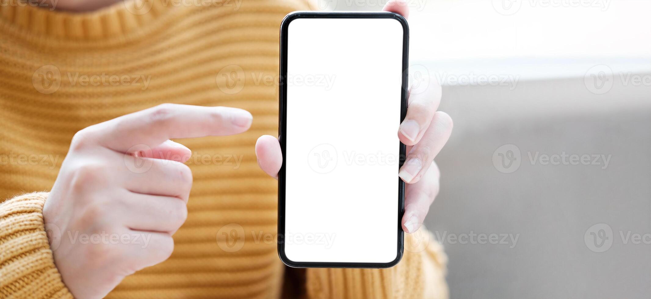 hand holding phone mobile and touching screen isolated on white background, mock-up smartphone matte black color photo