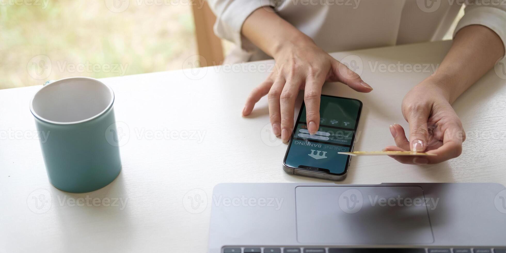 businesswoman hand using smart phone, tablet payments and holding credit card online shopping, omni channel, digital tablet docking keyboard computer at office in sun light photo