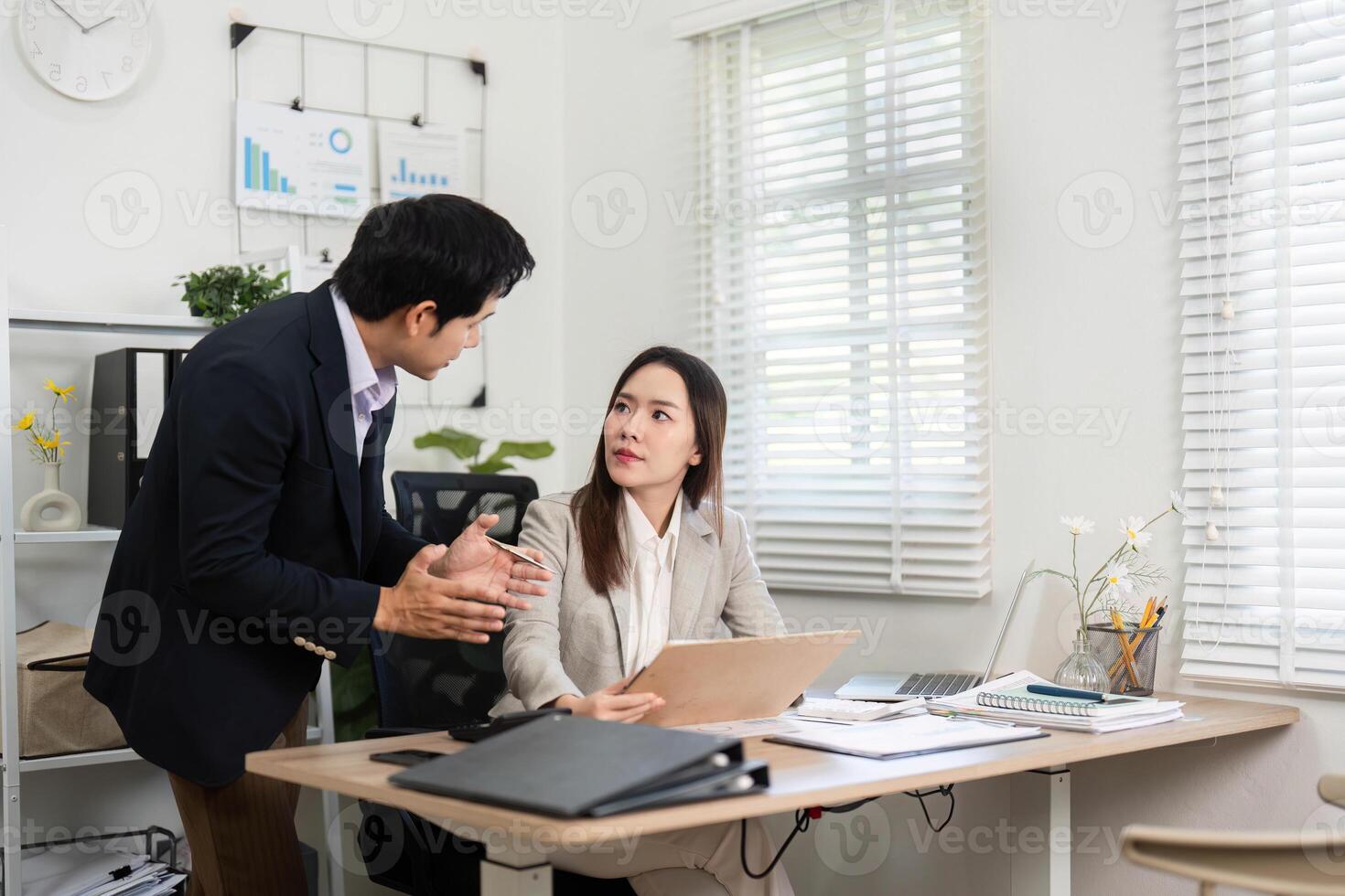 Financial Discussion and Planning. Engaged professionals collaborating in an office environment. photo