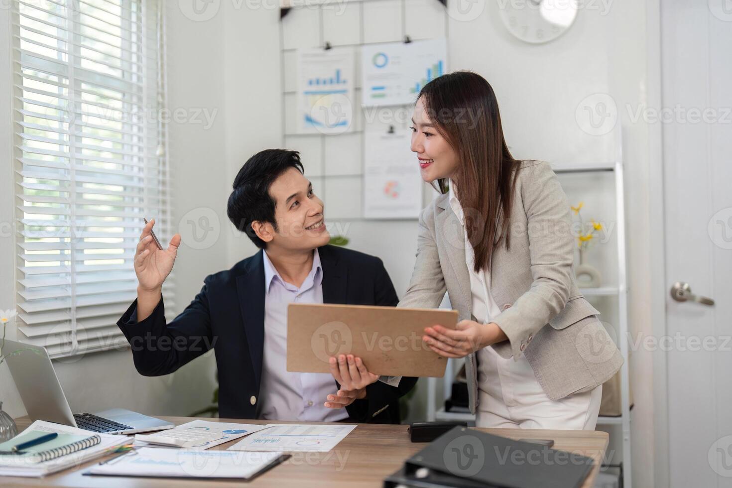 Financial Teamwork. Colleagues collaborating on business strategy in a bright office. photo