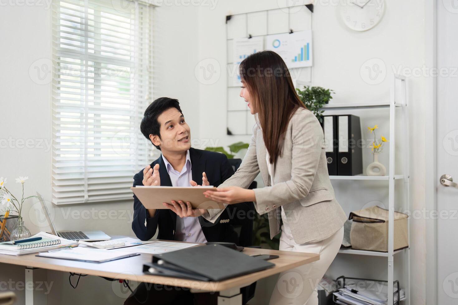 Financial Collaboration. Business professionals discussing project data in modern office. photo